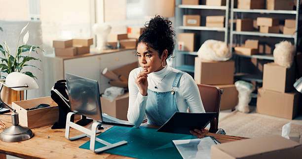 istock Business, thinking and woman with laptop, ecommerce and problem solving for online order. Person, pc and employee with decision, email and solution with delivery report, planning and supply chain 2241575684