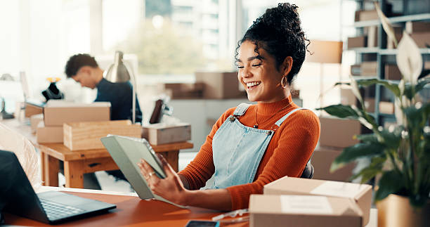 istock Smile, woman and reading on tablet for distribution checklist, courier update and supply chain. Small business, digital and person happy with funny reviews, inventory management and schedule shipping 2241575877