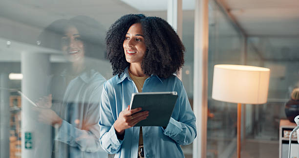 istock Thinking, glass and tablet with business woman in office for reflection, article fact check and review. Journalist vision, planning and research with person in news agency for perspective and project 2241578369