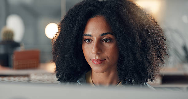 istock Computer, reading and business woman in office for content writing, review article or think at night. Tech, overtime and African copywriter with inspiration for blog, email campaign and research 2241578516