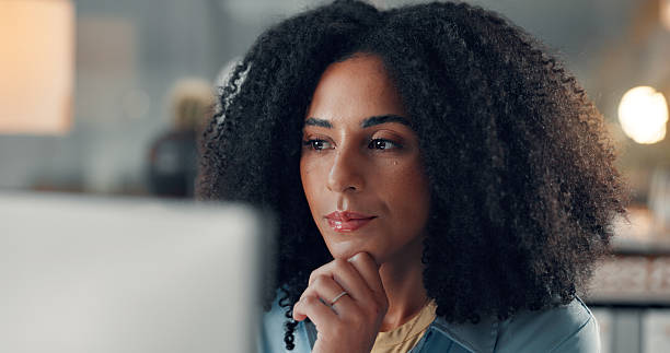 istock Business, thinking and woman in office, computer and online reading with creative agency. Copywriting, person and journalist with pc, internet and ideas for news report and research for article 2241578555