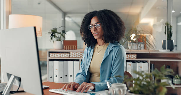 istock Woman, typing and employee with computer in office, administration or data entry of info on website. Online, transcriptionist and person with tech for financial report, graph and document in business 2241578655