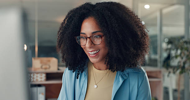 istock Computer, reading and happy business woman in office for content writing, article or think at night. Tech, overtime and African copywriter with inspiration for blog, email campaign and feedback 2241578668