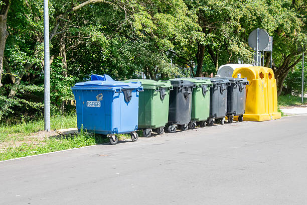 istock waste bins standing on the street 2241579194