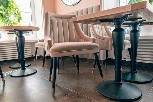 empty beige upholstered chairs in a coffee shop in the morning