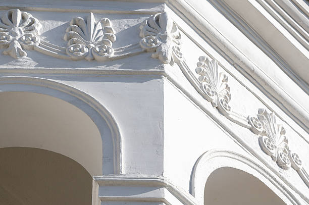 istock Renovated old building reflects elegance with stunning white stucco cornice 2241580936