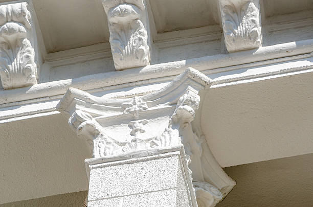 istock Renovated old building reflects elegance with stunning white stucco cornice 2241580961