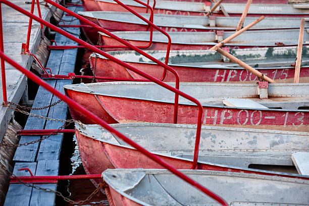 istock old battered boats are chained at the pier 2241581800