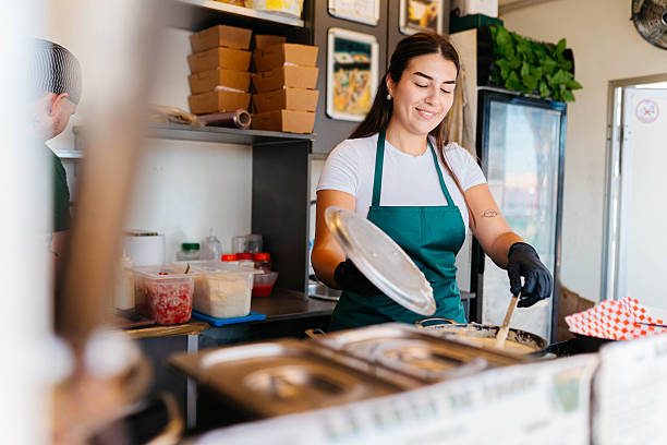 istock Female food van worker 2241583565