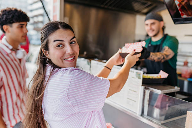 istock Happy pair enjoying street tacos 2241583740