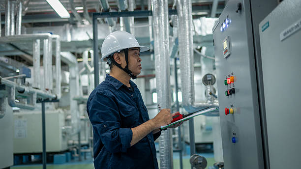 istock Engineers or technicians working extensive metal piping, HVAC systems, industrial equipment suggesting a controlled, well-maintained environment concept. 2241584031
