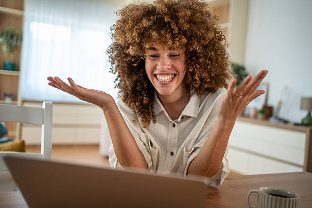 istock Woman smiling and gesturing during a video call on laptop 2241584829
