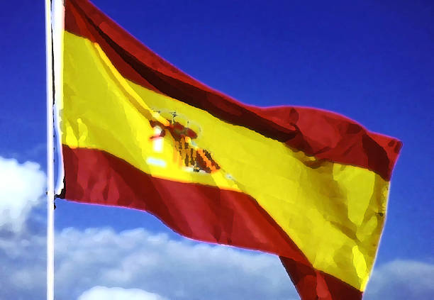 The national flag of Spain waving in the wind, symbolizing heritage, unity, and cultural identity