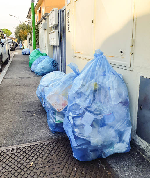 istock Plastic bags filled with household waste ready for curbside collection 2241590318