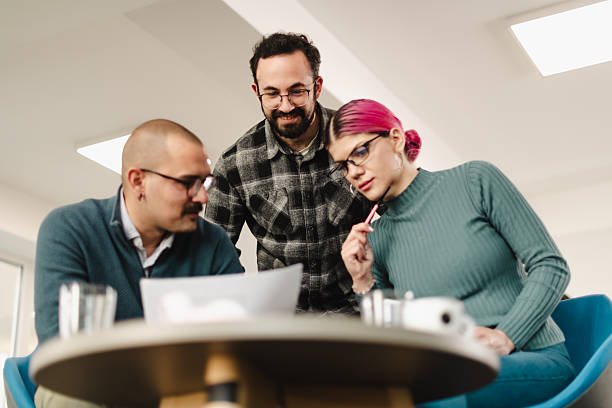 istock Business team collaborating on project in modern office space during daytime, sharing ideas and discussing strategies 2241591054
