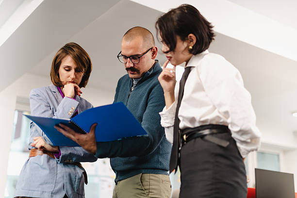 istock Business team collaborating on project strategies in a modern office setting during working hours 2241591190