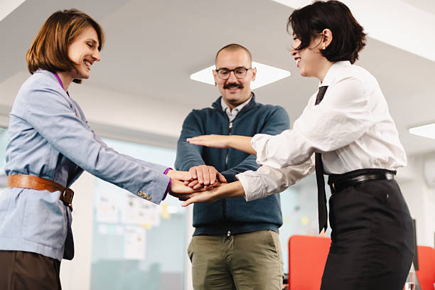 istock Businesspeople engaging in team-building activity in a modern office environment during a collaborative workshop session 2241591212