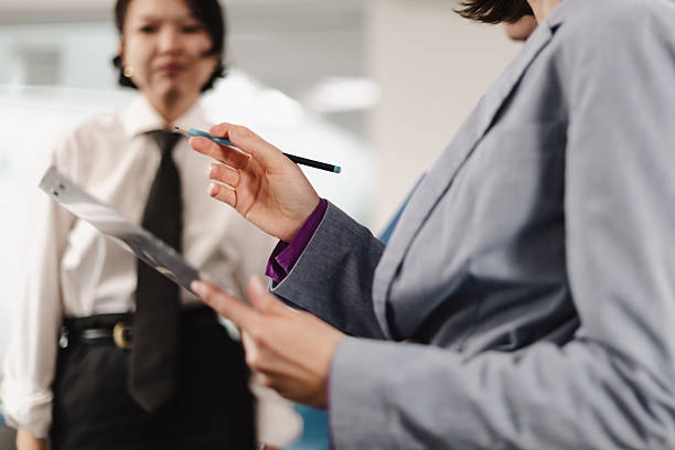 istock Business professionals engaging in a discussion in a modern office setting during a weekday morning 2241591276