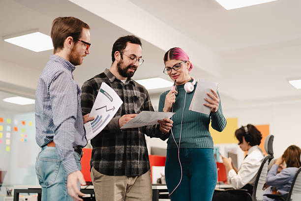 istock Business professionals collaborating in a modern office space during a team meeting to discuss project ideas and share insights 2241591394