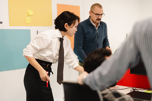 istock Business team collaborates in a modern office space with active discussions and planning on a project during a weekday meeting 2241592088