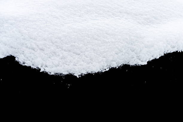 istock Natural snow isolated on black background 2241594608