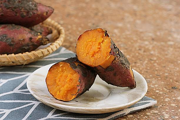 istock Roasted Japanese Sweet Potato Served on Ceramic Plate 2241595887