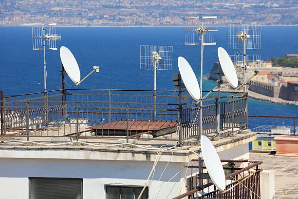 istock Rooftop TV and satellite dish antennas in Italy 2241597643