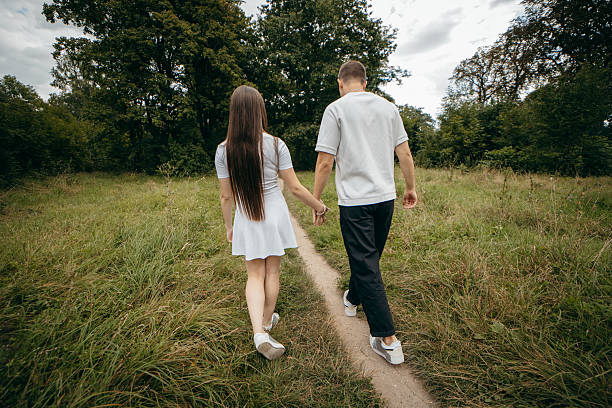istock Young couple walking at nature at summer 2241598599