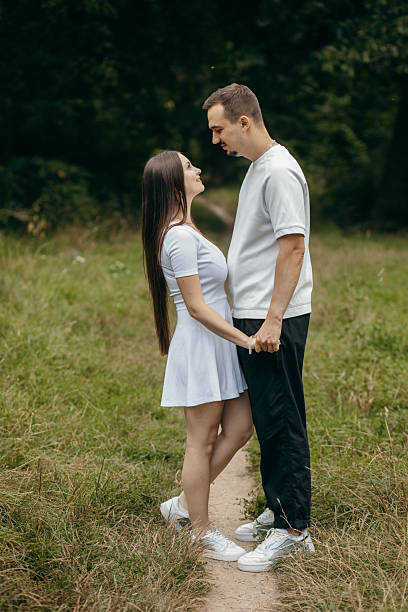 istock Young couple walking at nature at summer 2241598645