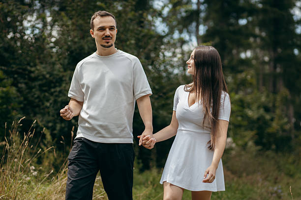 istock Young couple walking at nature at summer 2241598709