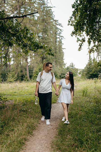 istock Young couple walking at nature at summer 2241598729
