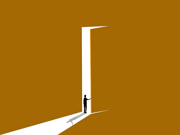 istock Businessman from darkness opens the door and sees light 2241598836