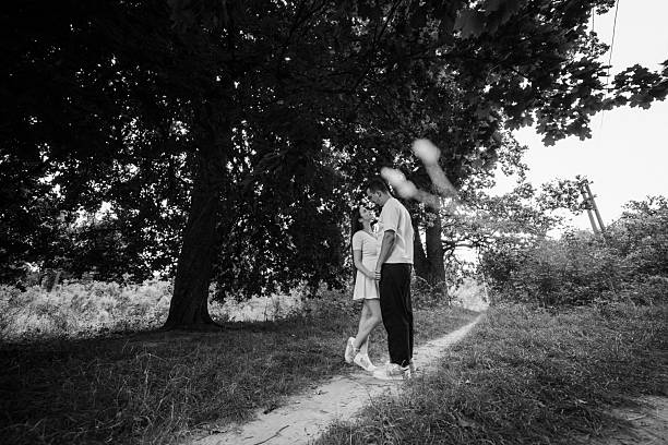 Young couple walking at nature at summer
