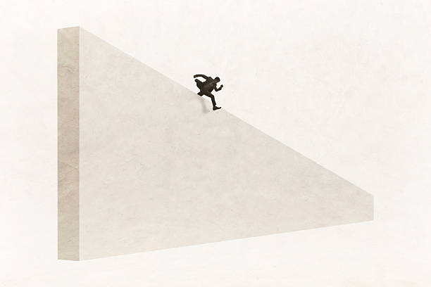 istock Businessman Hurdles Over Tall Obstacle 2241603390