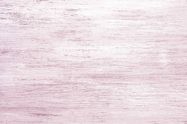 Pink painted wooden textured background with painted surface for design and presentation.
