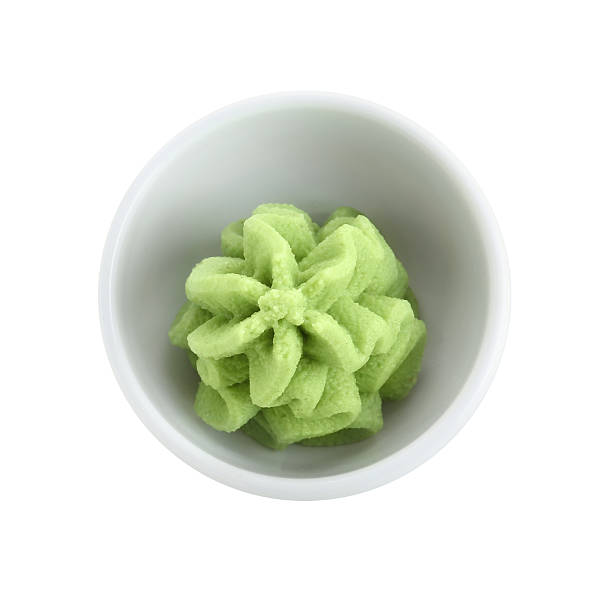 istock Hot wasabi paste in bowl isolated on white, top view 2241608106