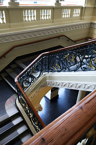 istock Classic Interior Architecture Featuring Spiral Staircase and Vintage Iron Details 2241609973