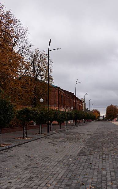 istock Town square on a cloudy autumn day, red brick buildings 2241611759