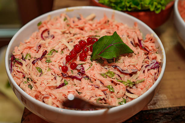 mixed salad with grated carrot, white cabbage and some purple cabbage