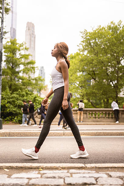istock Walking in the City Park 2241616280