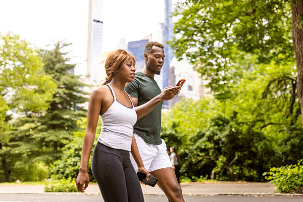 istock Couple Exercising in Park 2241616364