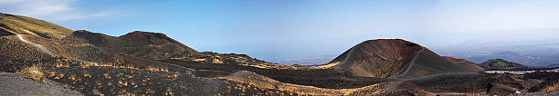 Beautiful panoramic mountain landscape on Mount Etna with craters during the day