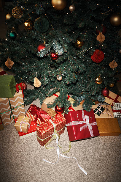 istock Christmas Tree Displaying Wrapped Gifts and Ornaments during Holiday Celebration 2241626662