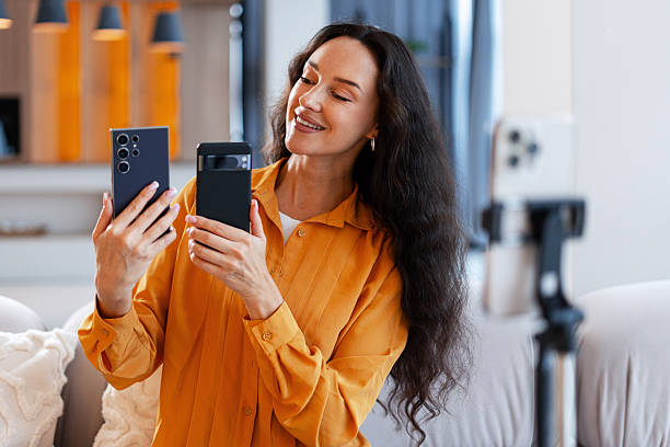 istock Woman video blogging smartphone comparison for tech review 2241628067