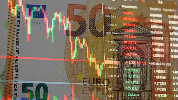 istock Red and Green Candlestick Chart with Euro Banknotes in the Background 2241631258