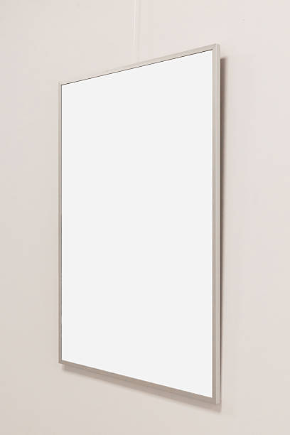 A blank picture frame is mounted on a light-colored wall, creating a minimalist ambiance.