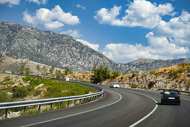 istock Highway leading into the mountains 2241632668
