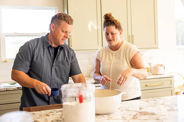 istock Parents in the kitchen together at home 2241632792
