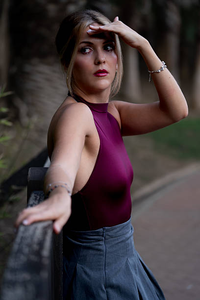 istock Young woman finding direction looking away in park 2241635289