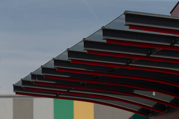 modern metal layered canopy design, architectural canopy featuring layered metal ribs and stripe patterns, design of contemporary architectural canopy with layered metal ribs and patterned stripes